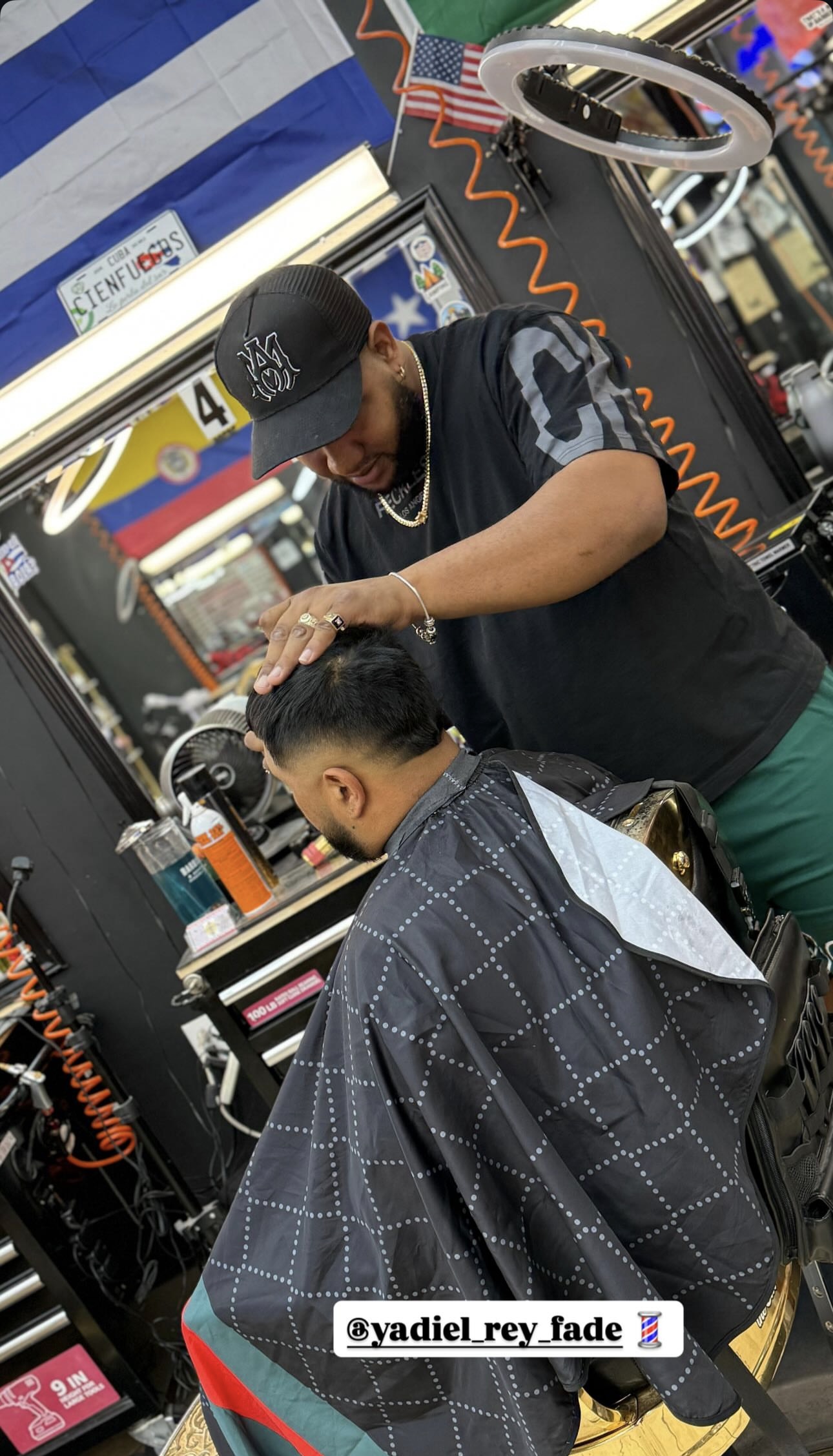 Yadiel, barber at Muma's
